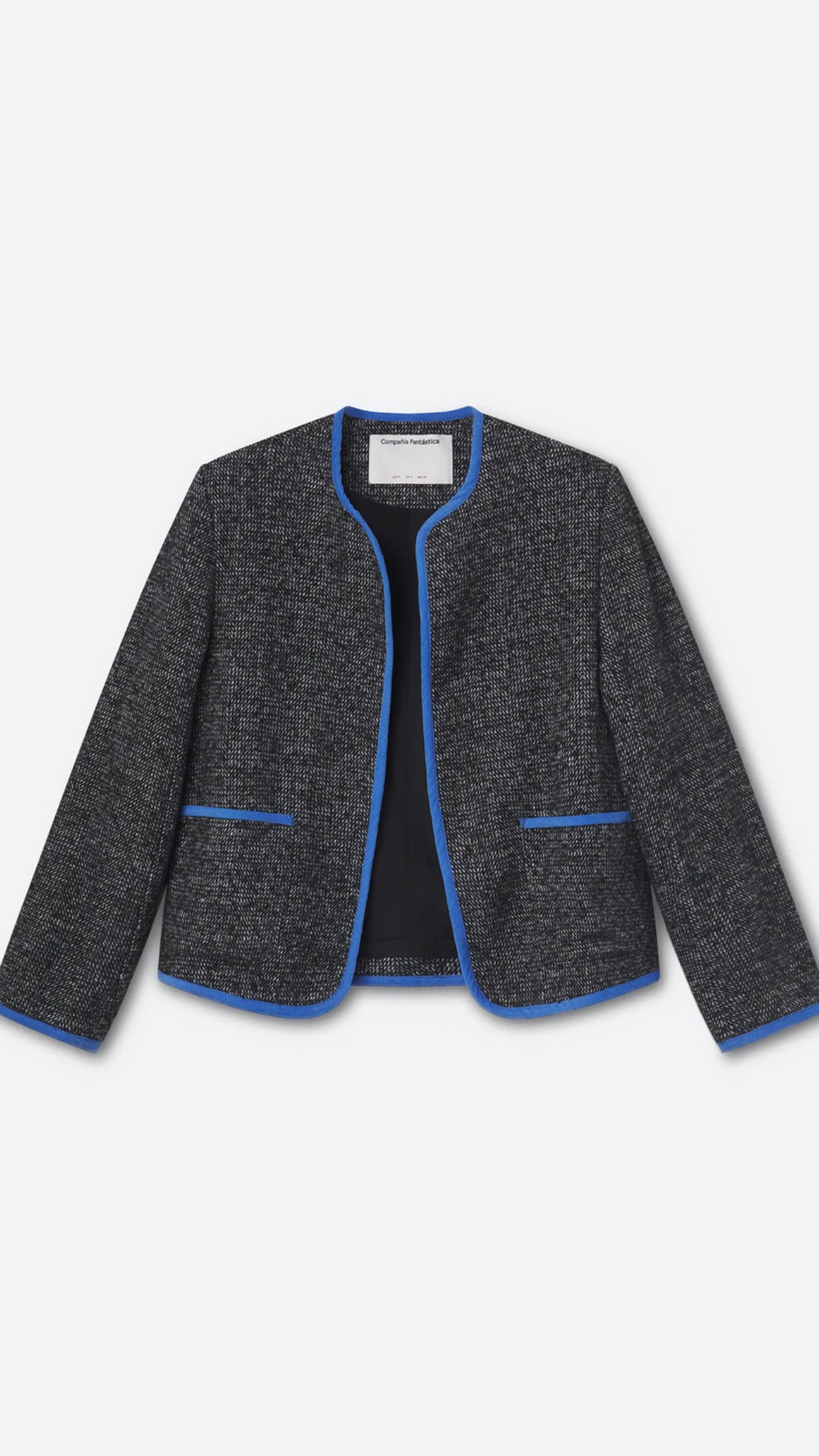Chaqueta tweed negra con detalles azul claro